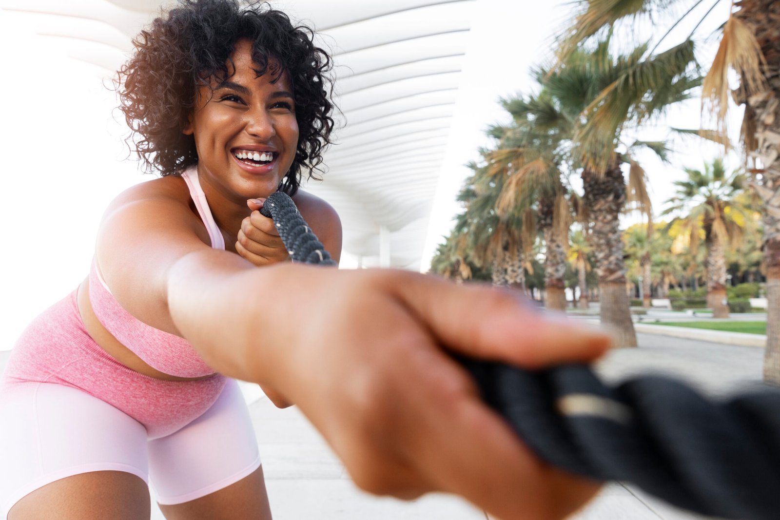 low-angle-smiley-woman-training